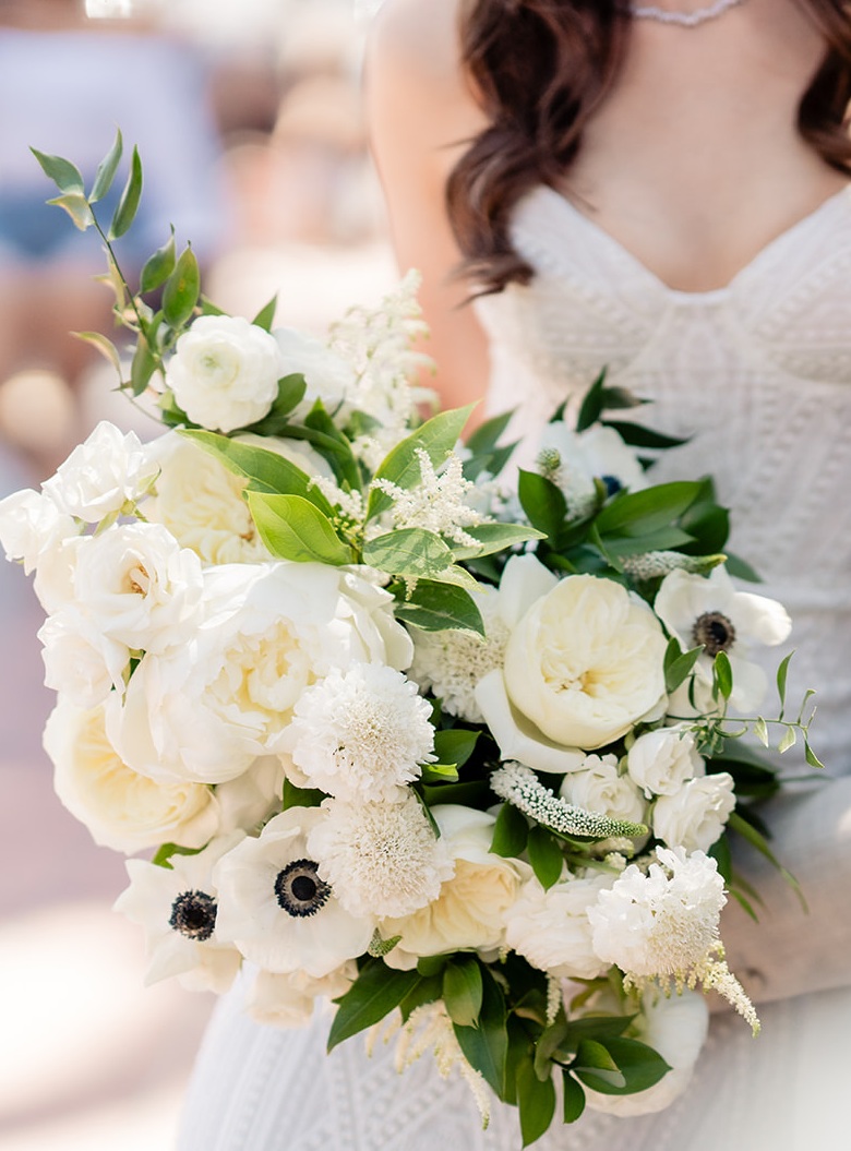 bride holding soft white bridal bouquet