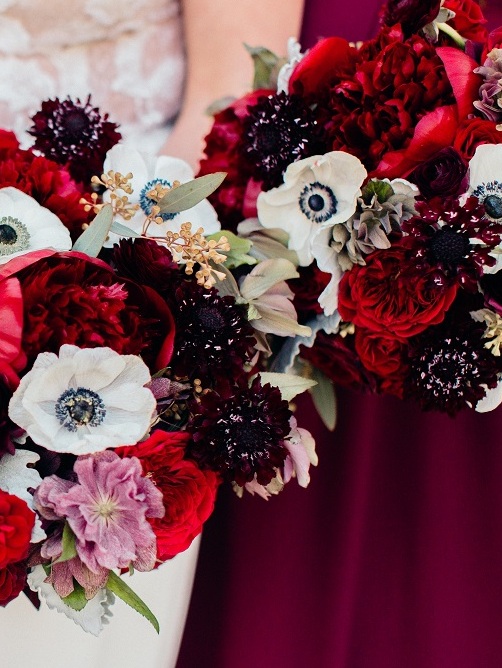 bride and bridesmaids with dark red and purple rich and dramatic wedding bouquets